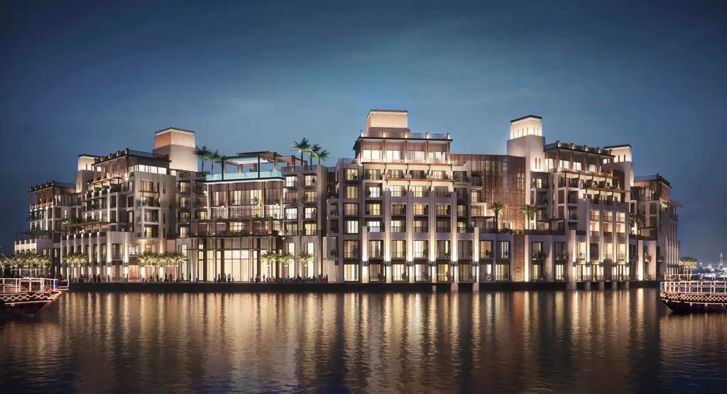 a building in front of a lake